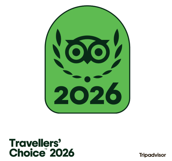 Green badge with an owl icon and '2026' text, labeled 'Travellers' Choice' by Tripadvisor.