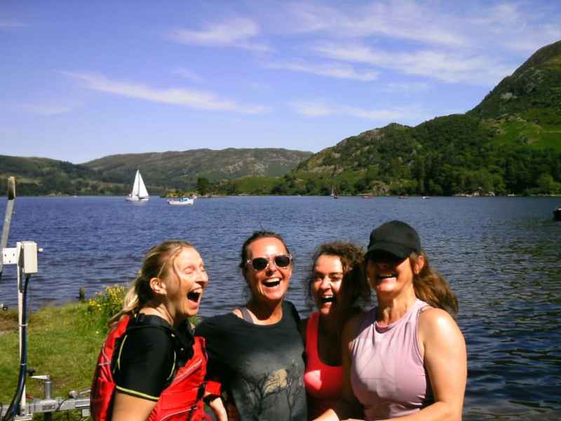 Group-of-friends-happy-after-kayaking-together A group of friends having a fantastic time experiencing the beauty of Ullswater.