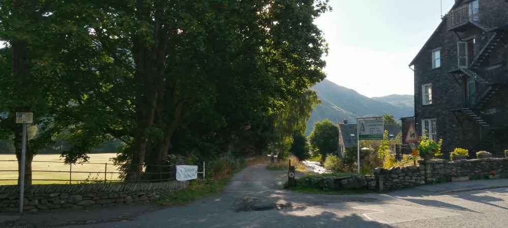 Entrance gate and gravel track down to the meeting place.